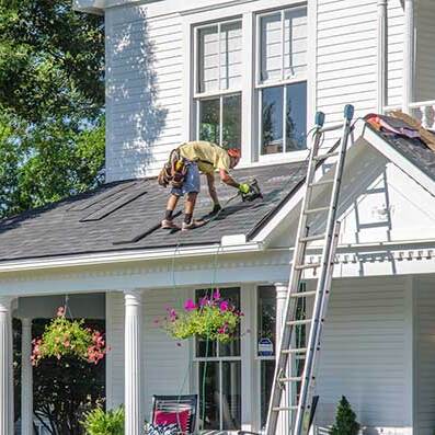 roofer making repairs